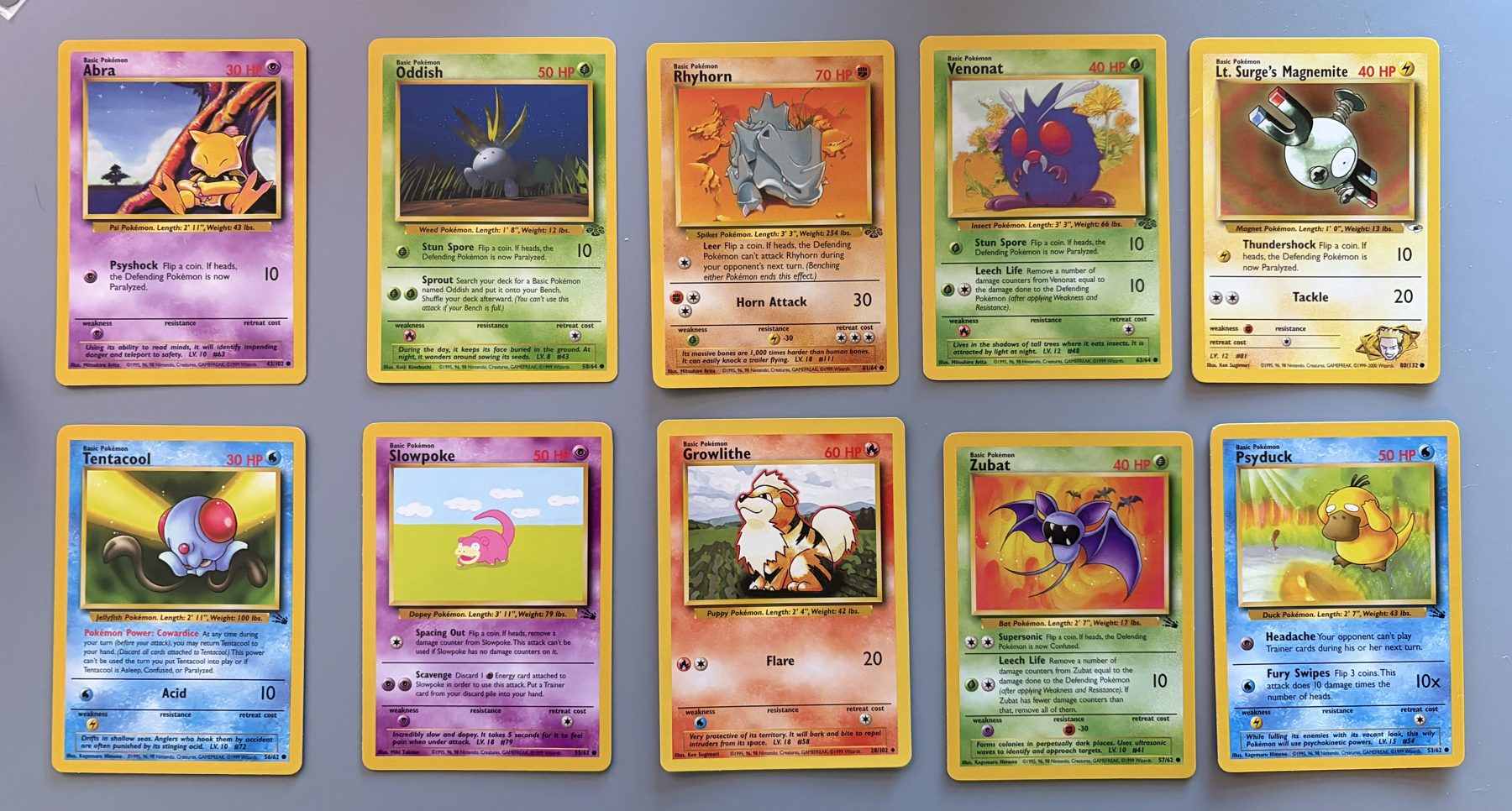 Vintage WOTC Pokémon 10-Card Lot – Psyduck, Abra, Lt. Surge's Magnemite, front